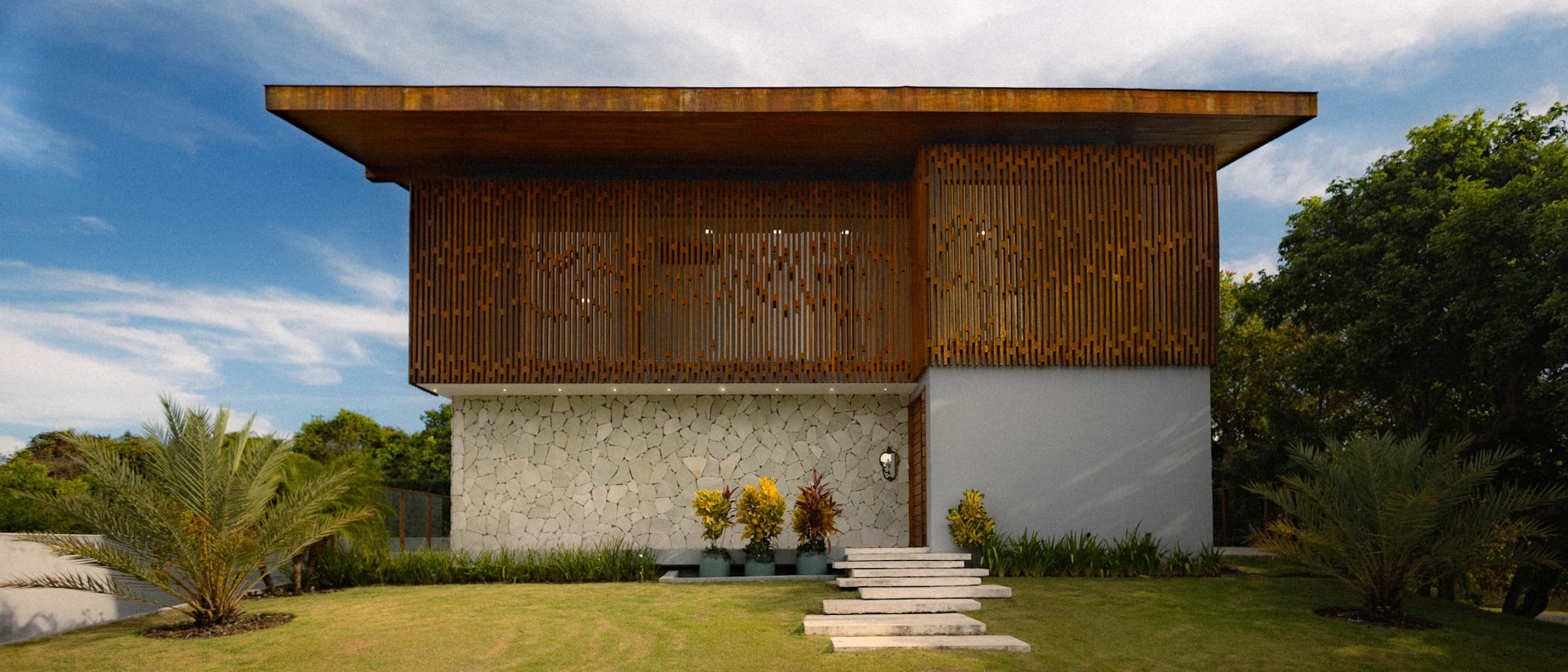 A timber-and-stone custom home by Stratum, set against a clear Melbourne sky.